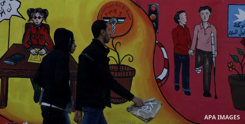 Palestinian Artists take part in paint a murals to mark the International Day for Persons with Disabilities on Dec. 03, 2011 in Gaza City.Photo by Mahmud Nassar