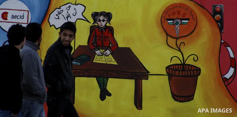 Palestinian Artists take part in paint a murals to mark the International Day for Persons with Disabilities on Dec. 03, 2011 in Gaza City.Photo by Mahmud Nassar