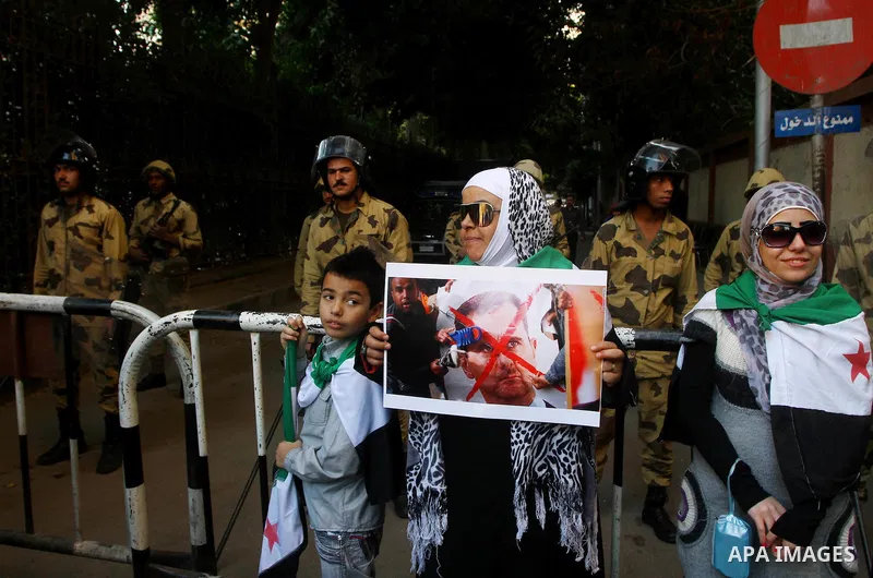 Syrians living in Egypt demonstrate against the recent actions of the Syrian government, in Cairo, Egypt on Dec 03,2011. Photo by Ashraf Amra