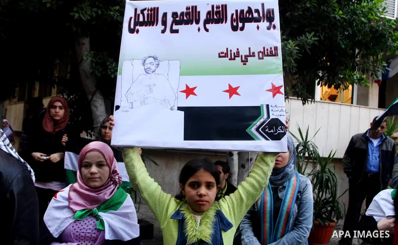 Syrians living in Egypt demonstrate against the recent actions of the Syrian government, in Cairo, Egypt on Dec 03,2011. Photo by Ashraf Amra