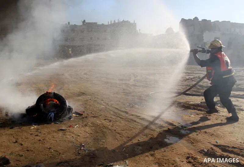 Members of the Palestinian civil defence demonstrate thier skills during a training session following the campaign "your Safety", in Gaza city on Dec. 04, 2011. Photo by Mohammed Asad