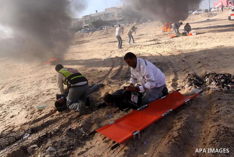 Members of the Palestinian civil defence demonstrate thier skills during a training session following the campaign "your Safety", in Gaza city on Dec. 04, 2011. Photo by Mohammed Asad