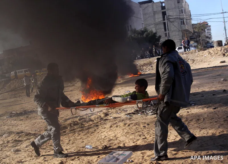 Members of the Palestinian civil defence demonstrate thier skills during a training session following the campaign "your Safety", in Gaza city on Dec. 04, 2011. Photo by Mohammed Asad