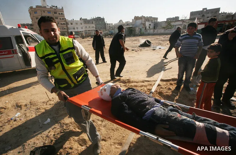 Members of the Palestinian civil defence demonstrate thier skills during a training session following the campaign "your Safety", in Gaza city on Dec. 04, 2011. Photo by Mahmud Nassar
