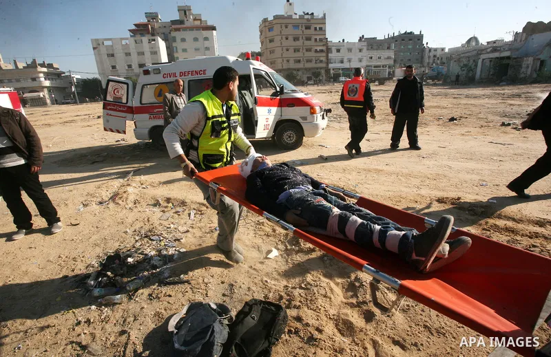 Members of the Palestinian civil defence demonstrate thier skills during a training session following the campaign "your Safety", in Gaza city on Dec. 04, 2011. Photo by Mahmud Nassar