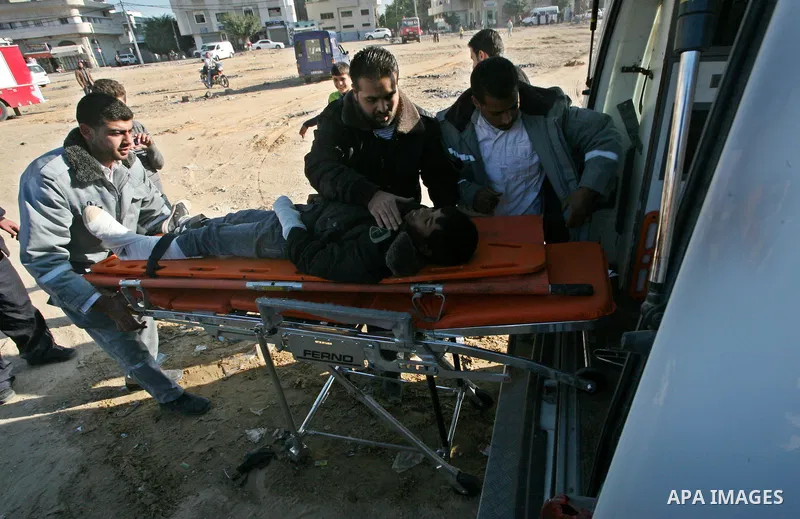 Members of the Palestinian civil defence demonstrate thier skills during a training session following the campaign "your Safety", in Gaza city on Dec. 04, 2011. Photo by Mahmud Nassar