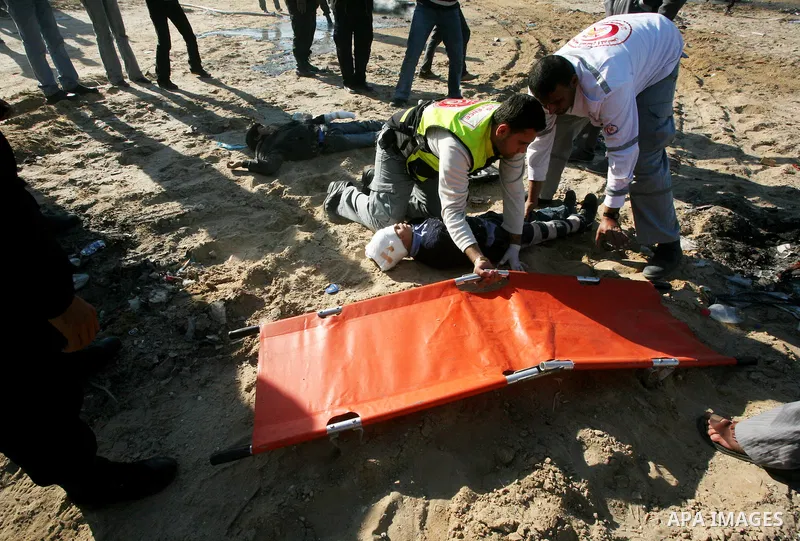 Members of the Palestinian civil defence demonstrate thier skills during a training session following the campaign "your Safety", in Gaza city on Dec. 04, 2011. Photo by Mahmud Nassar
