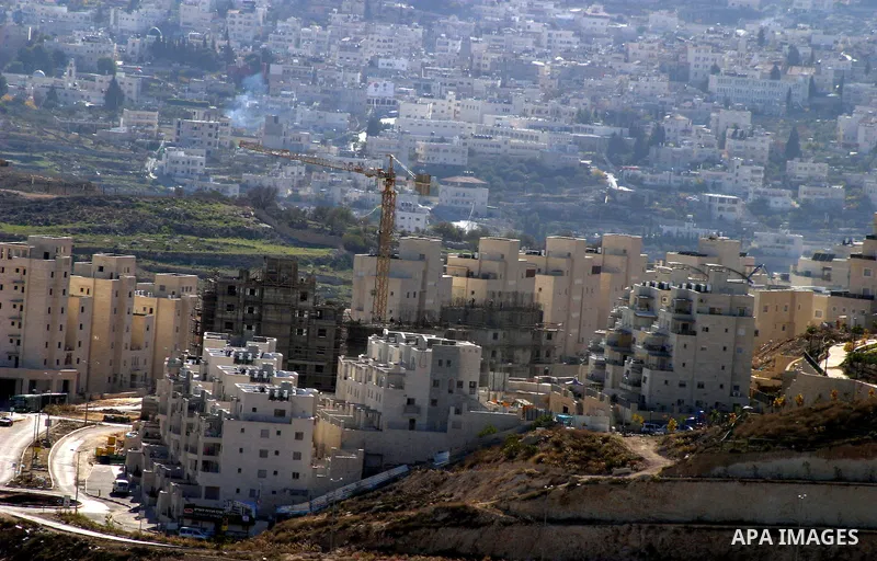 Workers construct new houses in the Jewish settlement known to Israelis as Har Homa near Jerusalem Dec. 4, 2011. Photo by Mahfouz Abu Turk