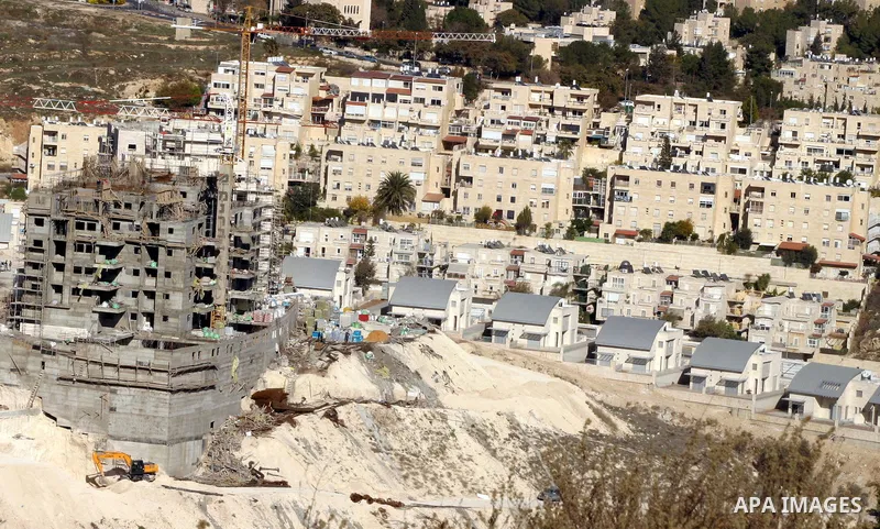 Workers construct new houses in the Jewish settlement known to Israelis as Har Homa near Jerusalem Dec. 4, 2011. Photo by Mahfouz Abu Turk