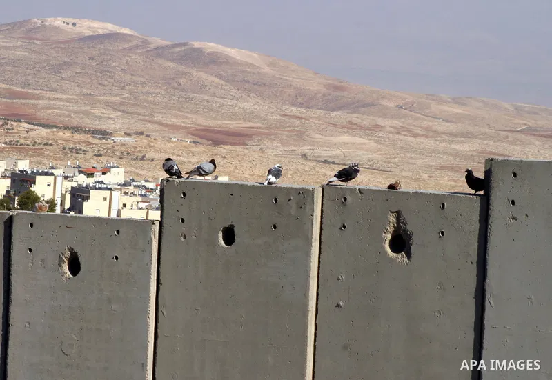 Israeli separation barrier is seen near the Jewish settlement known to Israelis as Bezgat Zeav near Jerusalem Dec. 4, 2011. Photo by Mahfouz Abu Turk