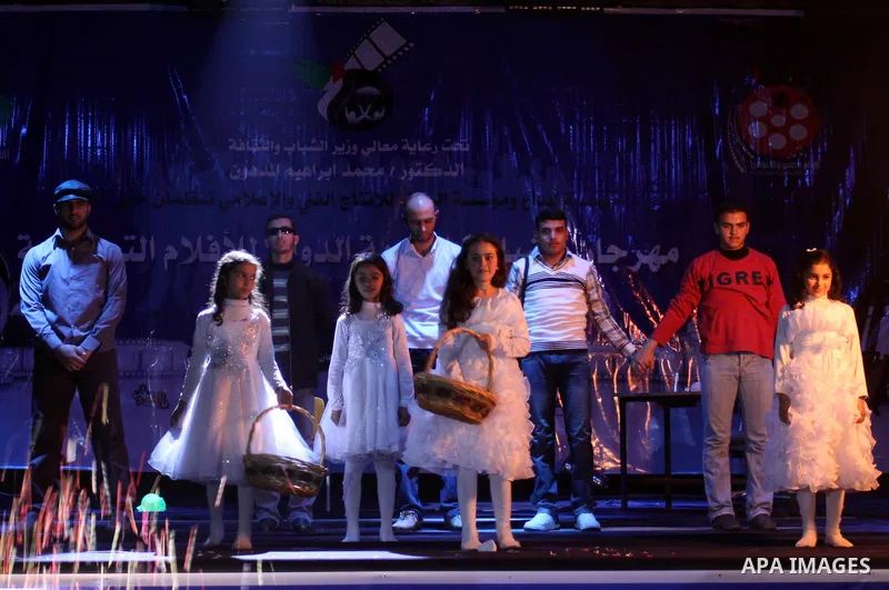 Palestinians participate in the international youth and freedom festival for documentary films at al-Shawwa Theatre, in Gaza city on Dec. 4,2011. Photo by Mohammed Asad