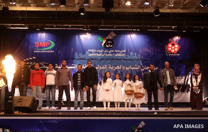 Palestinians participate in the international youth and freedom festival for documentary films at al-Shawwa Theatre, in Gaza city on Dec. 4,2011. Photo by Mohammed Asad