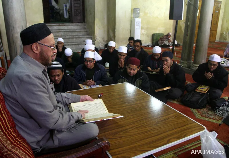 Indonesian Muslim students attend an Islamic religious course at Al-Azhar mosque in the old city of Cairo on December 4, 2011. Al-Azhar mosque, which was developed into one of the oldest Islamic universities, pays specia...