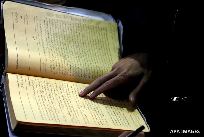 An Indonesian Muslim student reads from the Koran, Islam's holy book at Al-Azhar mosque in the old city of Cairo on December 4, 2011. Al-Azhar mosque, which was developed into one of the oldest Islamic universities, pays...