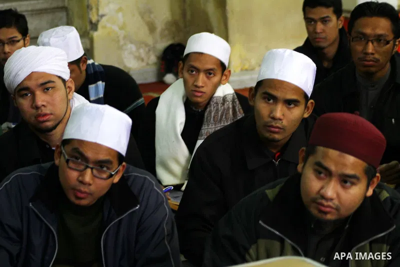 Indonesian Muslim students attend an Islamic religious course at Al-Azhar mosque in the old city of Cairo on December 4, 2011. Al-Azhar mosque, which was developed into one of the oldest Islamic universities, pays specia...