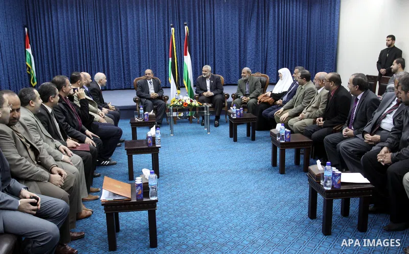Palestinian prime minister in Gaza Strip, Ismail Haniya meets with a delegation from Arab Doctors Union headed by Osama Raslan at his office in Gaza city on Dec. 5,2011. The delegation is in an official visit to Gaza Str...