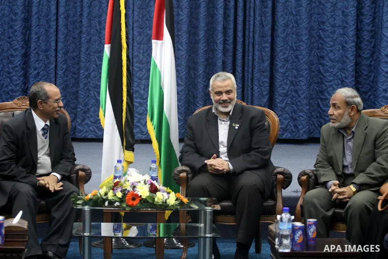 Palestinian prime minister in Gaza Strip, Ismail Haniya meets with a delegation from Arab Doctors Union headed by Osama Raslan at his office in Gaza city on Dec. 5,2011. The delegation is in an official visit to Gaza Str...