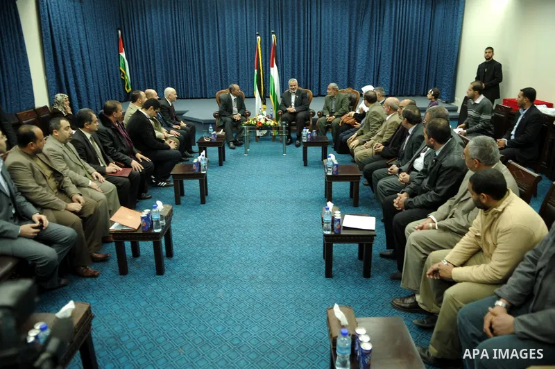 Palestinian prime minister in Gaza Strip, Ismail Haniya meets with a delegation from Arab Doctors Union headed by Osama Raslan at his office in Gaza city on Dec. 5,2011. The delegation is in an official visit to Gaza Str...