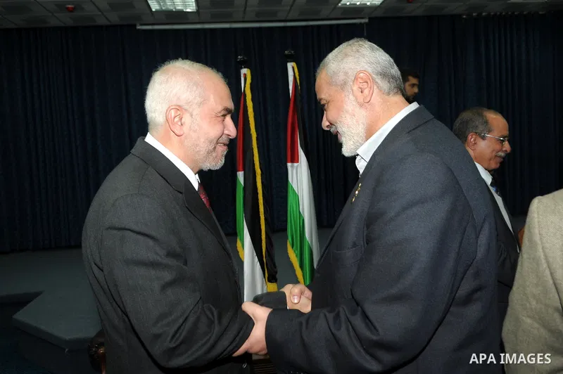 Palestinian prime minister in Gaza Strip, Ismail Haniya meets with a delegation from Arab Doctors Union headed by Osama Raslan at his office in Gaza city on Dec. 5,2011. The delegation is in an official visit to Gaza Str...