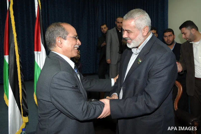 Palestinian prime minister in Gaza Strip, Ismail Haniya meets with a delegation from Arab Doctors Union headed by Osama Raslan at his office in Gaza city on Dec. 5,2011. The delegation is in an official visit to Gaza Str...
