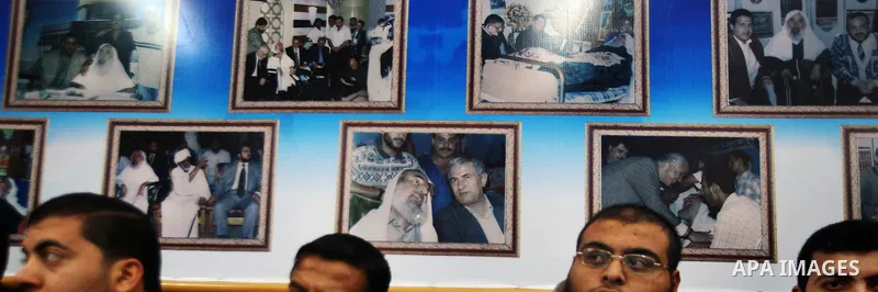 Palestinian Hamas supporters gather at the Hamas founder home, Ahmed Yaseen to announce the starting of the launch of celebrations marking the 24th anniversary of the Islamist movement's foundation, in Gaza City on Dec 5...