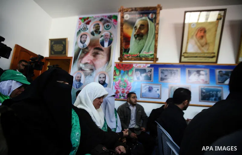 Palestinian Hamas supporters gather at the Hamas founder home, Ahmed Yaseen to announce the starting of the launch of celebrations marking the 24th anniversary of the Islamist movement's foundation, in Gaza City on Dec 5...