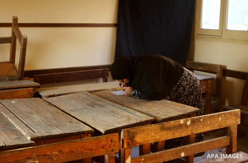 Egyptians cast their ballot at a parliamentary polling station in the run-off of the first round of voting in the Cairo on December 5, 2011. Islamist candidates in Egypt looked to extend their crushing victory in the cou...