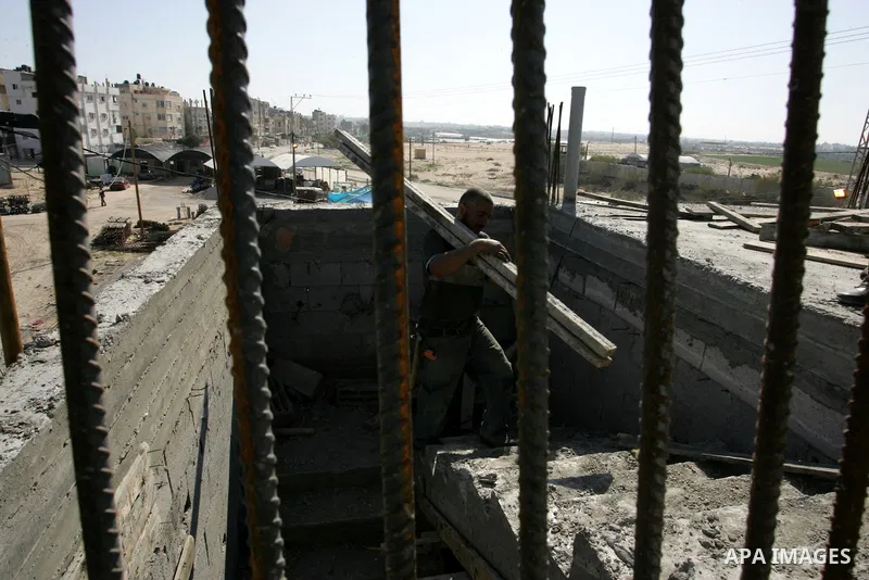 Palestinian laborours work to construct new houses in a project funded by the United Nations Relief and Works Agency for Palestine Refugees (UNRWA) in Rafah, in the southern of Gaza Strip on December 5, 2011. Israel main...