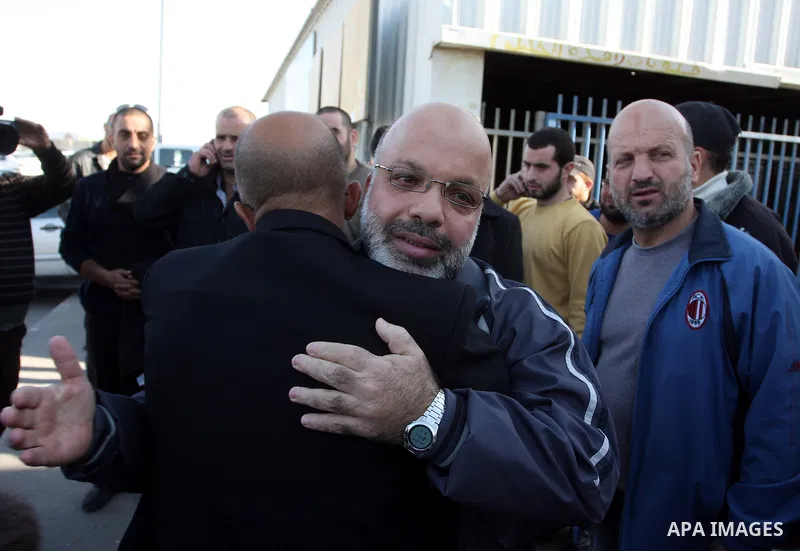 Palestinian lawmaker from Hamas , Ahmed Attoun, being welcomed by his friends at Kalandia checkpoint leading from Jerusalem to Ramallah, 06 December 2011, after his release from an Israeli jail. Atawni is a resident of E...