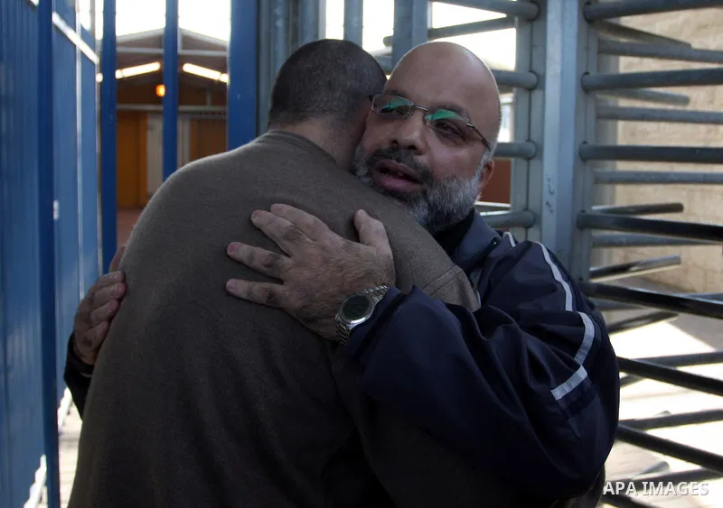 Palestinian lawmaker from Hamas , Ahmed Attoun, being welcomed by his friends at Kalandia checkpoint leading from Jerusalem to Ramallah, 06 December 2011, after his release from an Israeli jail. Atawni is a resident of E...