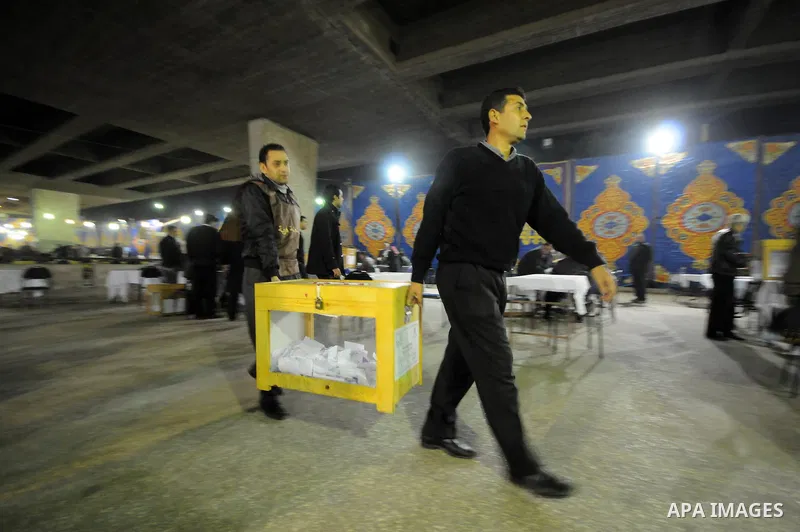 Egyptian election officials count ballots at the end the voting on the final day of the run-off for the first round of elections in Cairo on December 6, 2011. Photo by Ahmed Asad