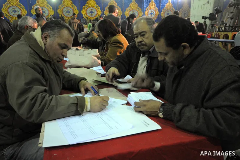Egyptian election officials count ballots at the end the voting on the final day of the run-off for the first round of elections in Cairo on December 6, 2011. Photo by Ahmed Asad