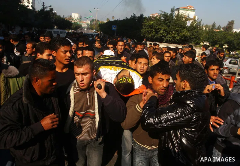 Palestinian mourners carry the body of Islamic Jihad militant Ismail Al-Areer during his funeral in Gaza City on December 7, 2011. A Palestinian was killed and five others were wounded by Israeli air strikes on the Gaza...