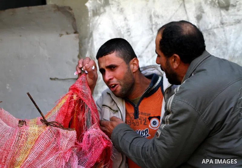 A Palestinian man mourns during the funeral of Islamic Jihad gunman Ismail Al-Areer in Gaza City December 7, 2011. A Palestinian was killed and five others were wounded by Israeli air strikes on the Gaza Strip early Wedn...