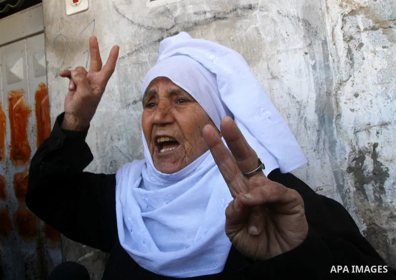 A Palestinian woman mourns during the funeral of Islamic Jihad gunman Ismail Al-Areer in Gaza City December 7, 2011. A Palestinian was killed and five others were wounded by Israeli air strikes on the Gaza Strip early We...