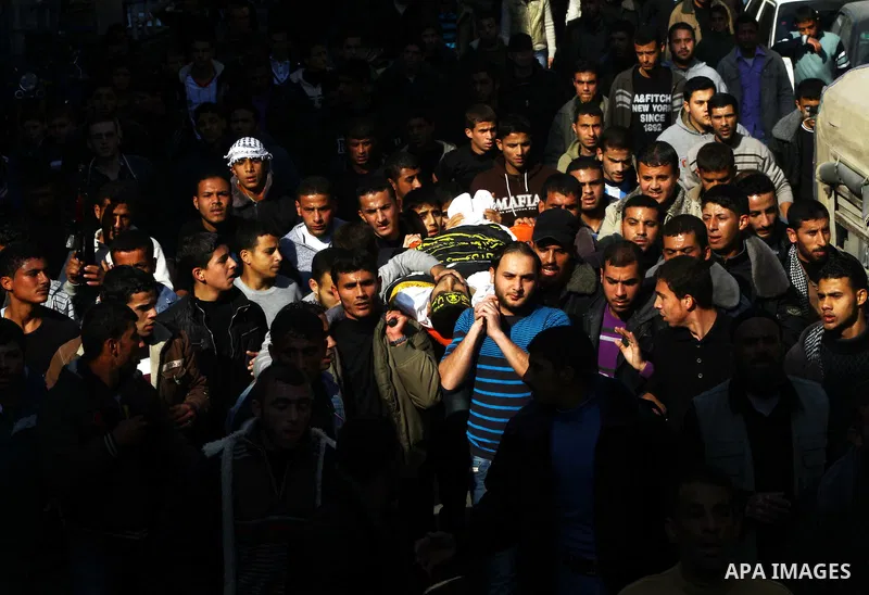 Palestinian mourners carry the body of Islamic Jihad militant Ismail Al-Areer during his funeral in Gaza City on December 7, 2011. A Palestinian was killed and five others were wounded by Israeli air strikes on the Gaza...