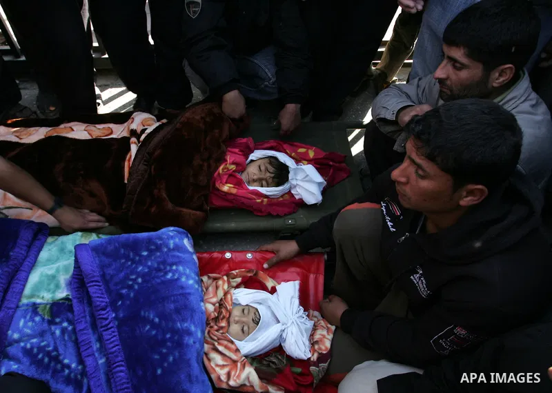 Palestinians protest in front of Khan Yunis Municipality headquarters during the funeral of Wesam,5 years, and his sister Malak Sahloul,3 years, in Khan Younis, southern Gaza Strip on December 7, 2011. Wesam and Malak we...