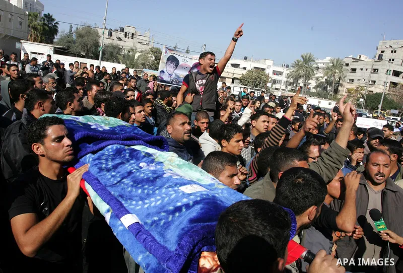 Palestinians protest in front of Khan Yunis Municipality headquarters during the funeral of Wesam,5 years, and his sister Malak Sahloul,3 years, in Khan Younis, southern Gaza Strip on December 7, 2011. Wesam and Malak we...