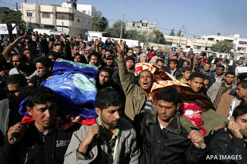 Palestinians protest in front of Khan Yunis Municipality headquarters during the funeral of Wesam,5 years, and his sister Malak Sahloul,3 years, in Khan Younis, southern Gaza Strip on December 7, 2011. Wesam and Malak we...