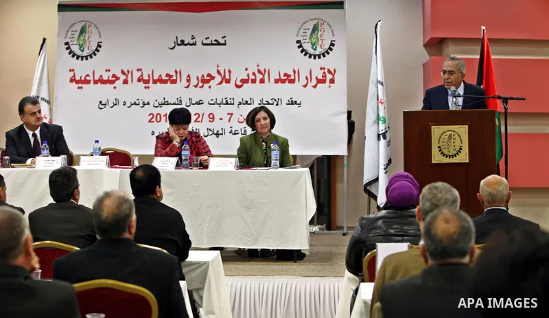 Palestinian Prime Minister, Salam Fayyad delivers speech during the Fourth Conference of the General Federation of Trade Unions of Palestine in the West Bank city of Ramallah on Dec. 8,2011. Photo by Mustafa Abu Dayeh
