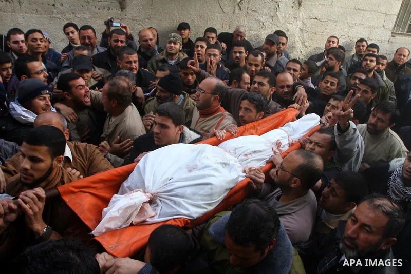 Palestinians carry the bodies of Sobhi al-Batsh, a member of Hamas's armed wing the Ezzedine al-Qassam Brigades, and Issam al-Batsh, a senior member of the Al-Aqsa Martyrs Brigades, outside their home during their funera...