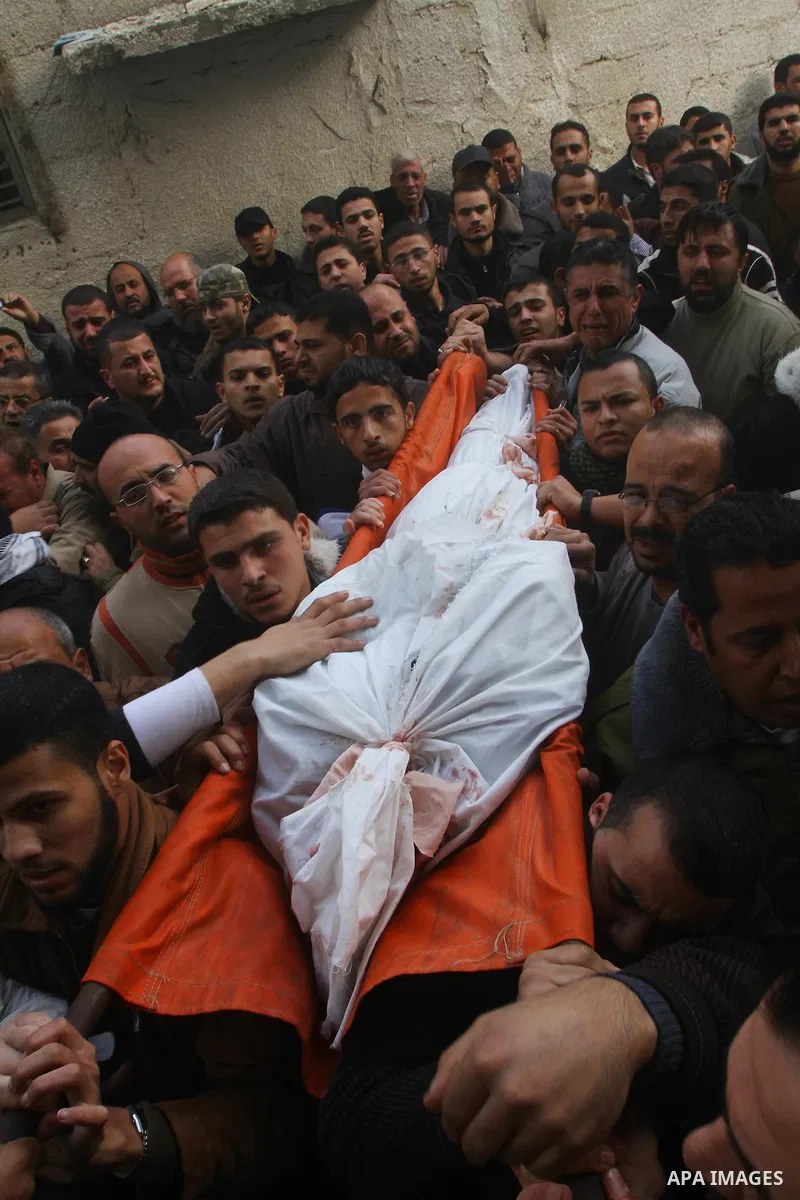 Palestinians carry the bodies of Sobhi al-Batsh, a member of Hamas's armed wing the Ezzedine al-Qassam Brigades, and Issam al-Batsh, a senior member of the Al-Aqsa Martyrs Brigades, outside their home during their funera...