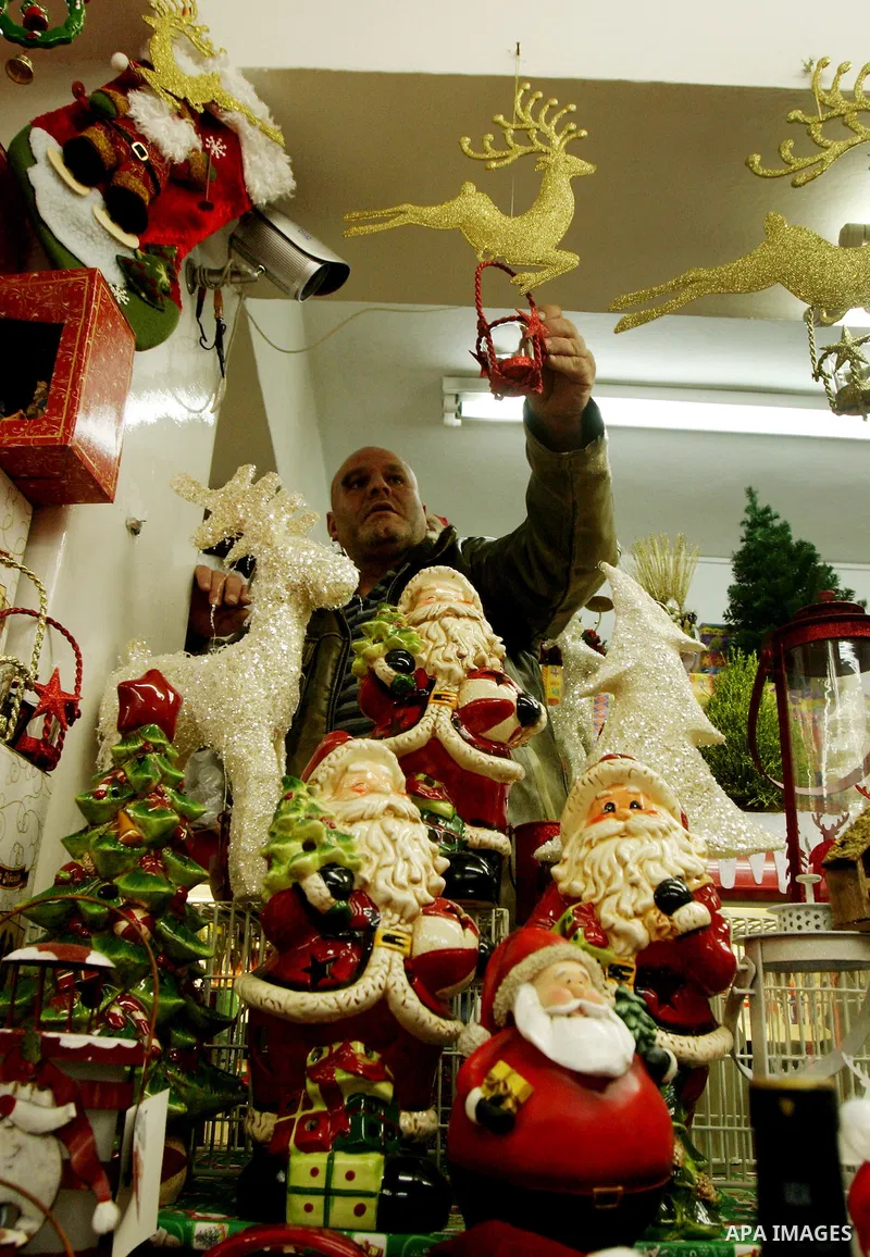 A Palestinian vendor displays products for Christmas Day at his shop, in Jerusalem's old city, Thursday, on Dec. 8, 2011. Christians Pilgrims and tourists are expected to visit Bethlehem, the alleged birthplace of Jesus...