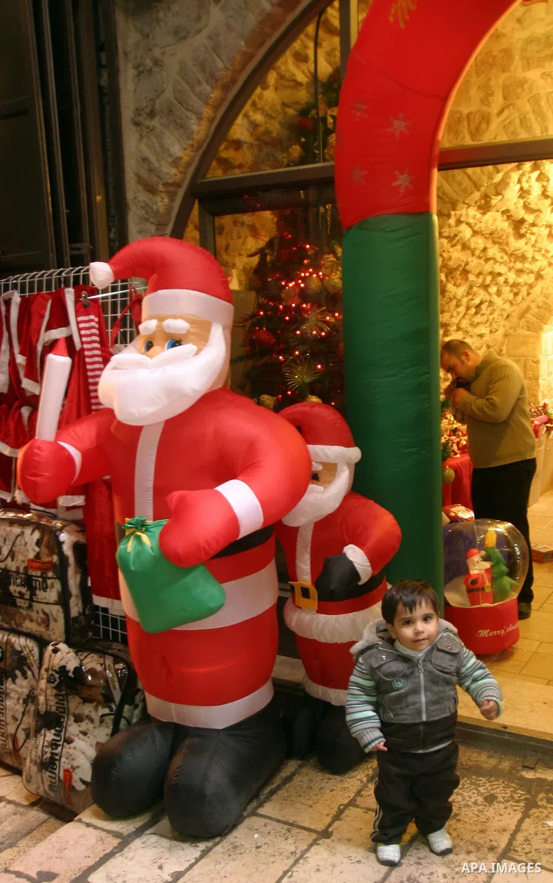 A Palestinian vendor displays products for Christmas Day at his shop, in Jerusalem's old city, Thursday, on Dec. 8, 2011. Christians Pilgrims and tourists are expected to visit Bethlehem, the alleged birthplace of Jesus...