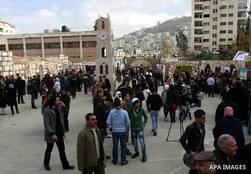 Palestinians participate in an exhibition for national industries in the West Bank city of Nablus, Thursday, Dec. 8, 2011. Photo by Wagdi Eshtayah.