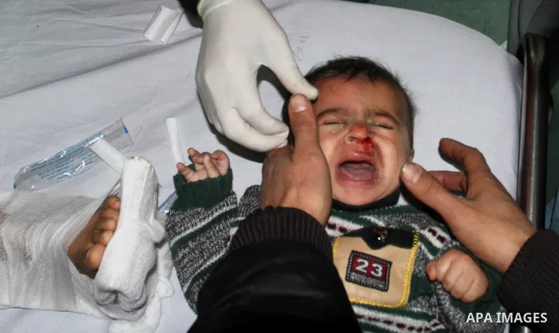 Palestinian doctors care for a wounded boy at al-Shifa hospital in Gaza City on December 9, 2011, after an Israeli air strike killed at least one Palestinians and wounded others, Palestinian medical and security sources...