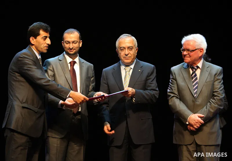 Palestinian Prime Minister, Salam Fayyad attends a celebration to distribute prizes for youth inventions in the West Bank city of Ramallah on Dec. 8, 2011. Photo by Mustafa Abu Dayeh