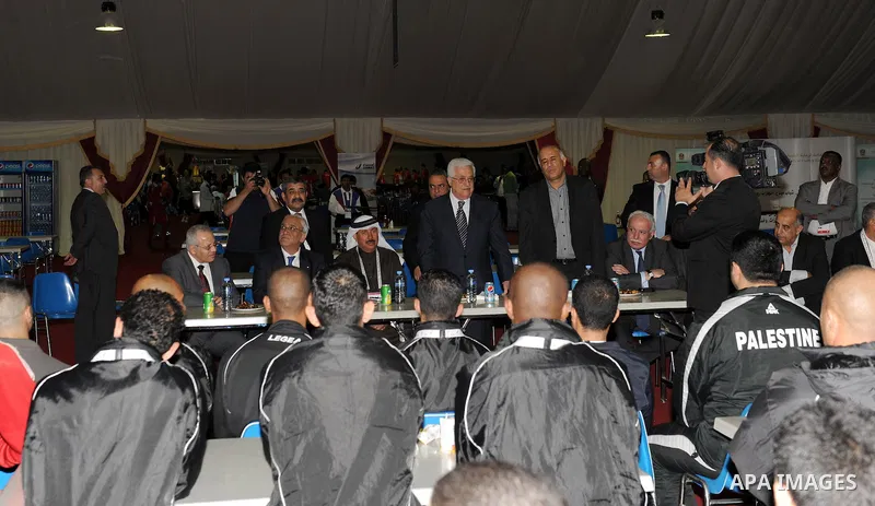 Palestinian President Mahmoud Abbas (Abu Mazen) visits the members of Palestinian mission for Olympic Games in Qatar, in Qatar on Dec. 8,2011. Photo by Thaer Ganaim