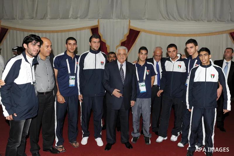 Palestinian President Mahmoud Abbas (Abu Mazen) visits the members of Palestinian mission for Olympic Games in Qatar, in Qatar on Dec. 8,2011. Photo by Thaer Ganaim