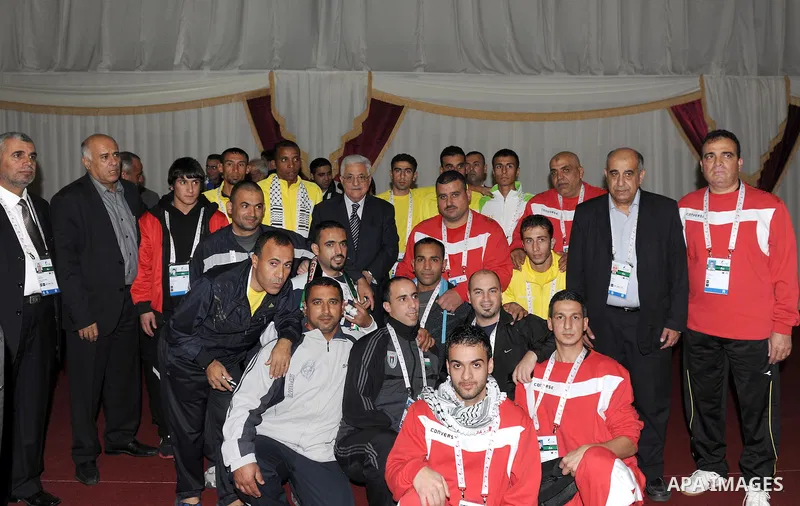 Palestinian President Mahmoud Abbas (Abu Mazen) visits the members of Palestinian mission for Olympic Games in Qatar, in Qatar on Dec. 8,2011. Photo by Thaer Ganaim